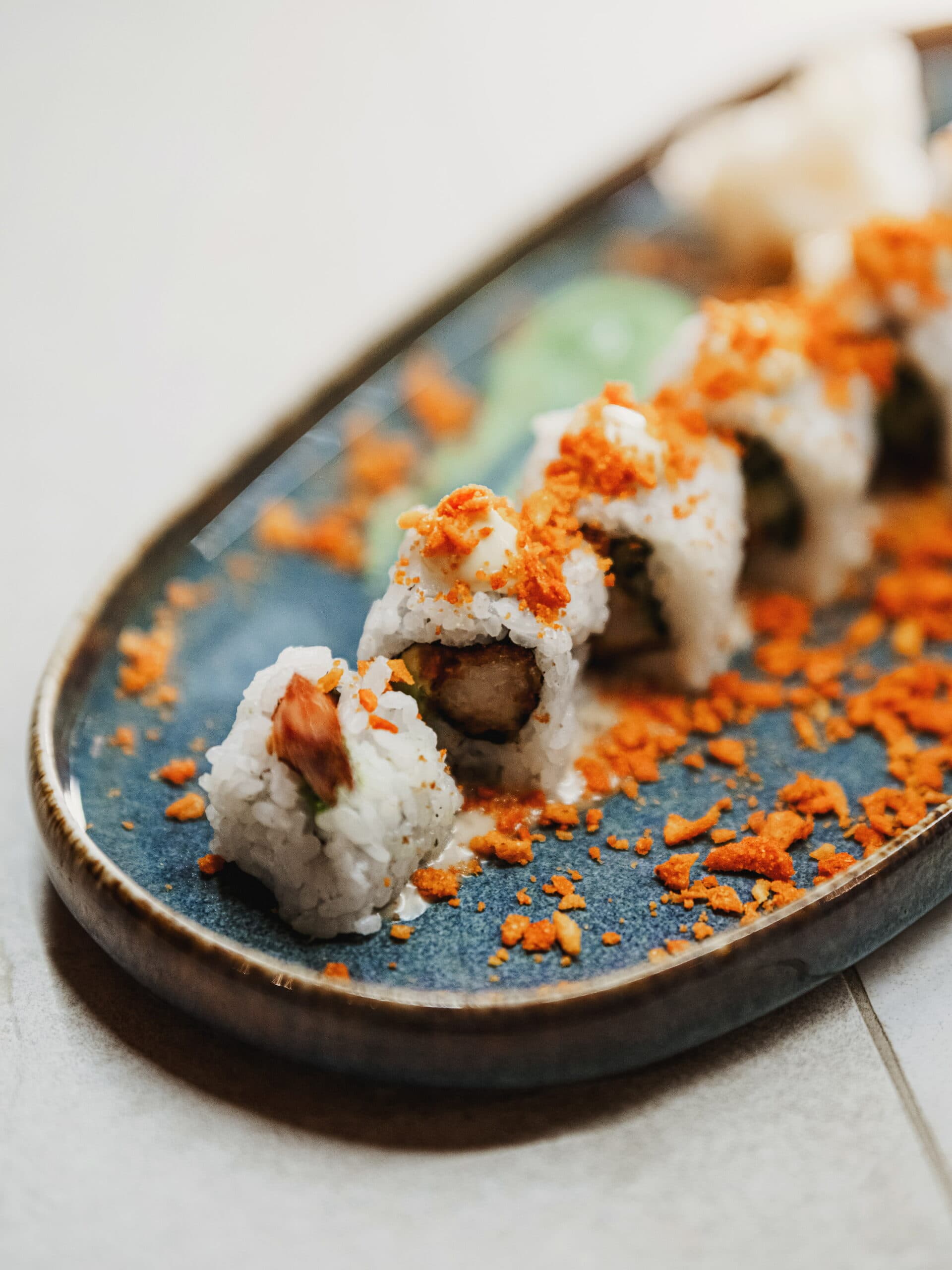 Signature maki roll on ceramic plate
